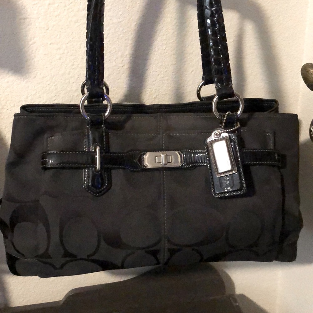 Medium black coach bag.